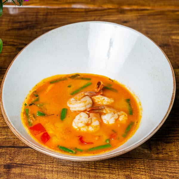 Jaew Thai Cuisine's spicy Tom Yum soup with shrimp, green beans, and red bell peppers.